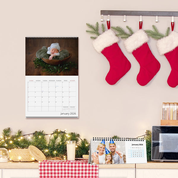 Decorative setup with Christmas stockings, calendar, and festive decorations on a wall.