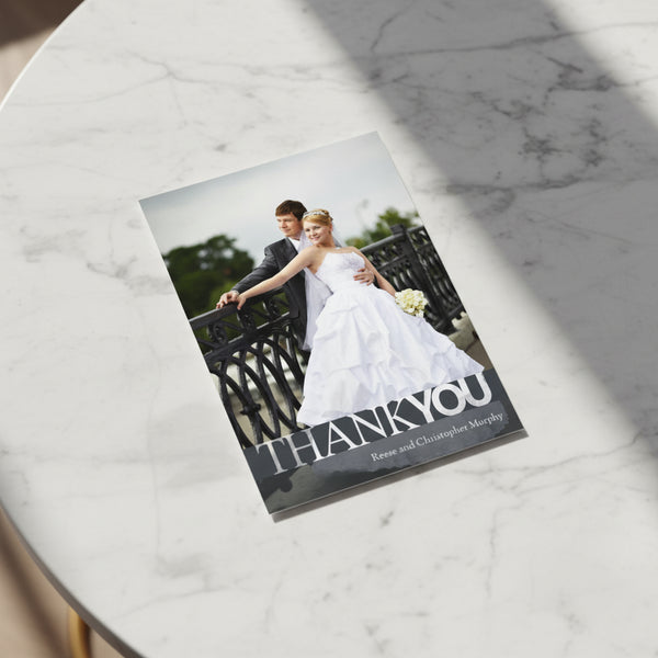 Wedding card with a couple on a bridge and 'Thank You' text.